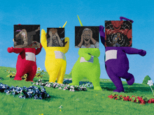 a group of teletubbies are standing in a field