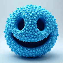 a blue ball that looks like a smiley face made of blue balls