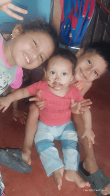 a baby wearing a pink shirt that says ' i love you ' on it