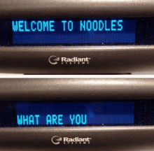 a radiant systems device displays the words welcome to noodles and what are you