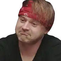 a man wearing a black shirt and a red headband with the letter o on it