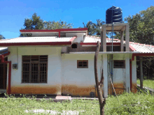 a house with a water tank on the side