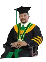 a man in a graduation cap and gown with a ring on his finger