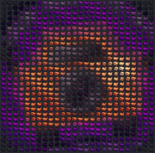 a pattern of purple and orange dots on a dark background