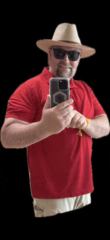 a man wearing a hat and sunglasses takes a selfie