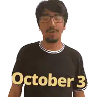 a man wearing glasses and a black shirt with the date october 3