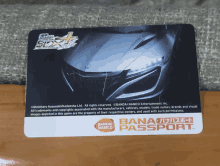 a bandai namco passport card with a car on it