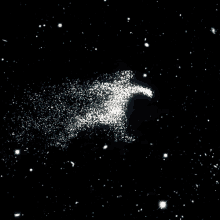 a black background with a lot of stars and a white object