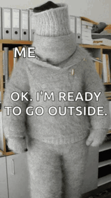 a person wearing a sweater that says me ok i 'm ready to go outside on it