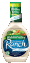 a bottle of ranch dressing is sitting on a table on a white background .