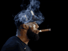 a man is smoking a cigar with smoke coming out of his mouth