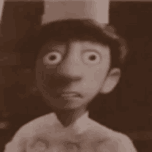 a black and white photo of a cartoon character wearing a chef 's hat and making a funny face .