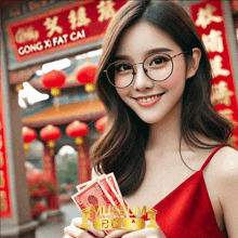 a woman holding a bunch of money in front of a sign that says gong xi fat cai