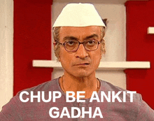 a man wearing glasses and a white hat says ' chup be ankit gadha ' in white letters