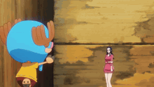 a woman in a red dress is standing next to a cartoon character