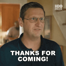 a man with glasses says thanks for coming in a hbo max ad