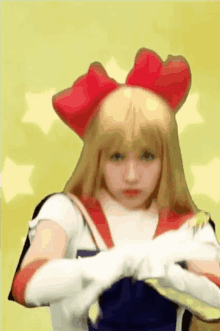 a woman in a sailor moon costume is making a funny face .