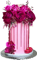 a pink cake with pink flowers and red drips on it