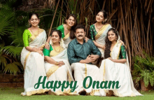 a family posing for a picture with the words happy onam