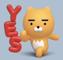 a yellow teddy bear is holding a red balloon that says y