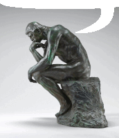 a statue of a man sitting on a rock with a speech bubble above him