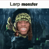a man with dreadlocks is wearing a beanie and smiling with the words larp monster above him .