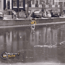 a pixelated image of a man ice skating with the words monkey baby business below