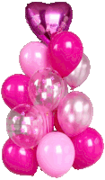 a bunch of pink balloons with a heart shaped foil balloon in the middle