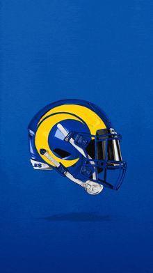 a blue and yellow football helmet with the letter r on it