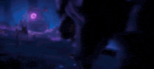 a close up of a person 's face in a dark room with a purple background .