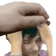 a hand is holding a man 's head in a pixel art style .