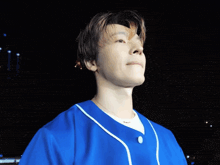 a man wearing a blue jersey with a question mark on his forehead