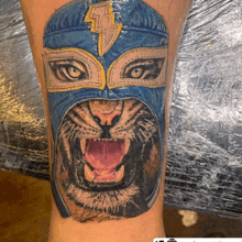 a tattoo of a tiger wearing a wrestling mask