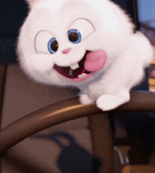 a white stuffed animal with blue eyes is sticking out its tongue