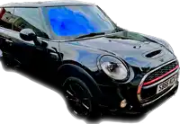 a black mini cooper with a license plate that says sb66kz