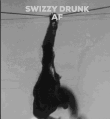 a black and white photo of a chimpanzee with the words swizzy drunk af on the bottom