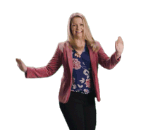 a woman wearing a pink jacket and a floral shirt is dancing