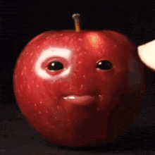 an apple with a face painted on it 's face