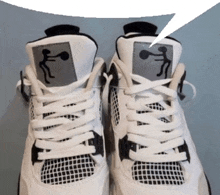 a pair of white and black sneakers with a speech bubble in the background