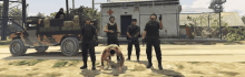 a group of soldiers standing in front of a building with a red cross