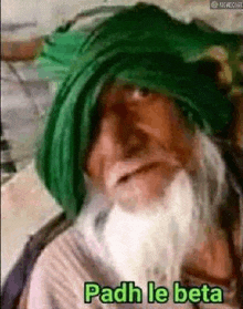 an elderly man with a beard and a green turban is saying padh le beta .