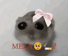 a cat with a pink bow on its head and a cigarette next to it with the word mesa written in red