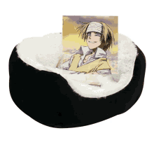 a black dog bed with a picture of a man with a bandage on his head on it