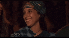 a woman wearing a bandana that says california on it