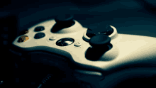 a close up of a video game controller with a few buttons