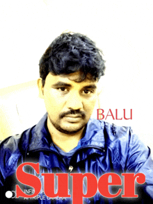 a man in a blue jacket with the name balu on the bottom