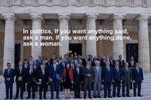 a group of people standing in front of a building with the words in politics if you want anything said