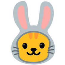 a cat is wearing a bunny costume with pink ears .