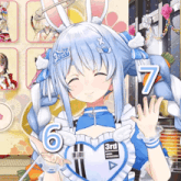 a girl with bunny ears is wearing a blue apron that says 3rd