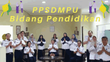 a group of people posing for a picture with the words ppsdmpu bidang pendidikan in the background